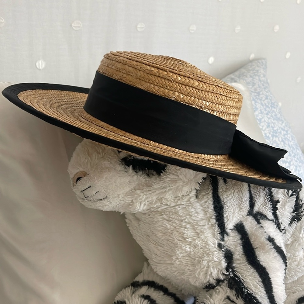 Straw hat with black trim & bow